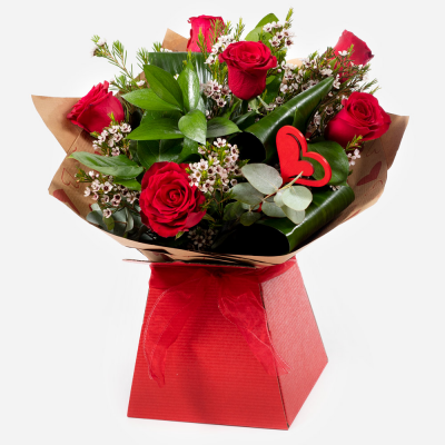 Kissing Booth - Who could resist you after receiving this selection of the beautiful red roses matched to the finest seasonal foliage.