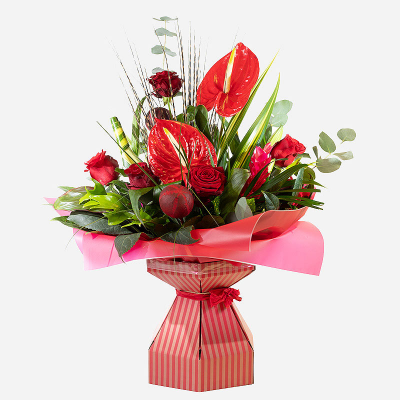 Power of Love - Show the power of ‘your’ love by sending this exquisite arrangement to that special person in your life. Infused with red roses,  tropical flowers and foliage, this stunning composition is all you need to show them how much they mean to you. PLEASE NOTE: this product may not be possible for same day delivery.